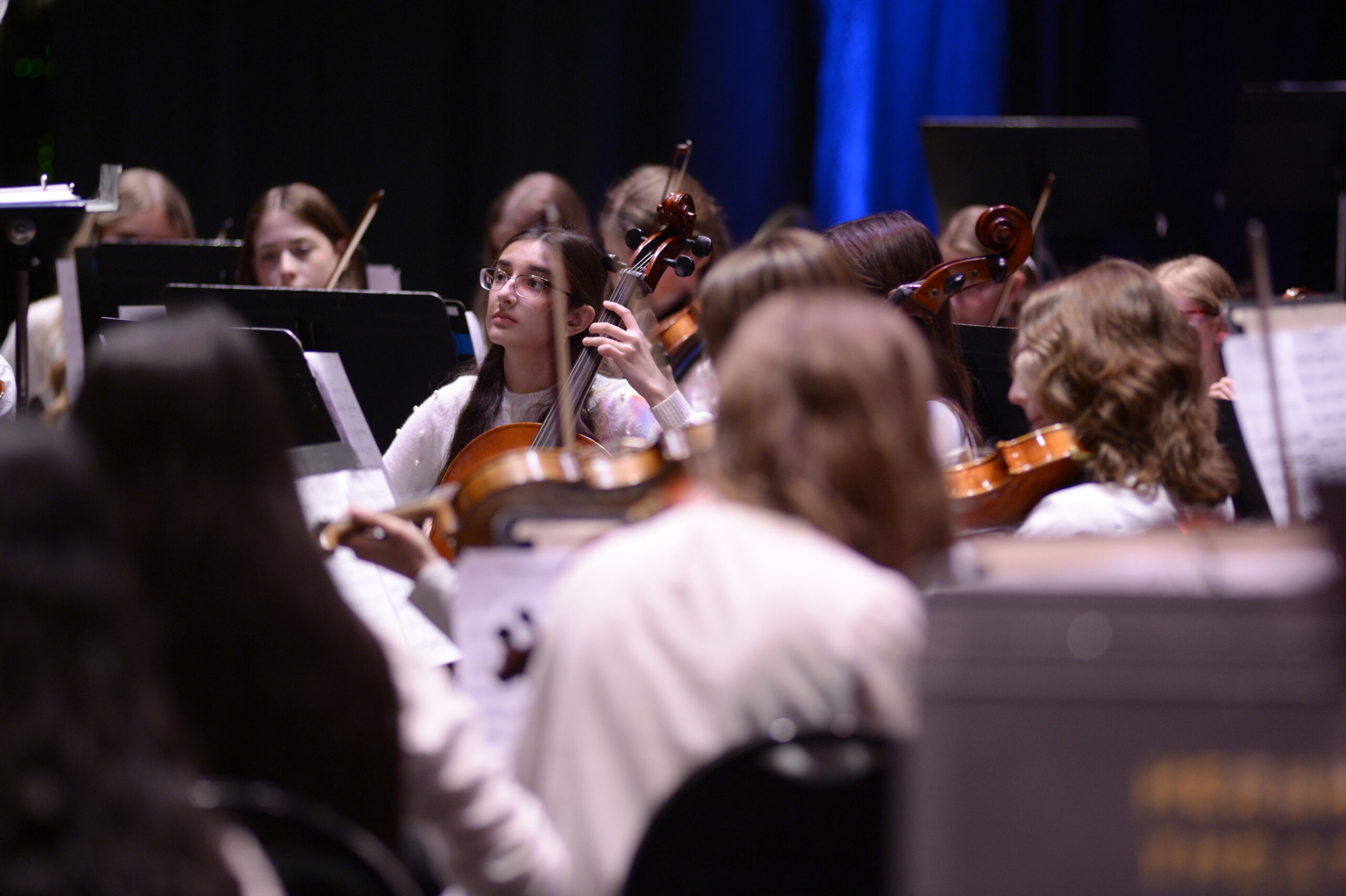 young musicians playing in orchestra