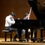 teen boy playing piano