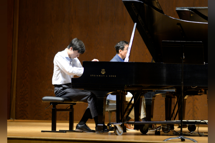 teen boy playing piano