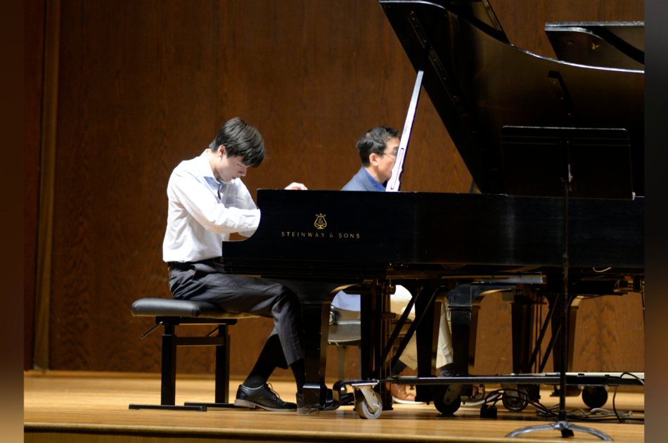 teen boy playing piano