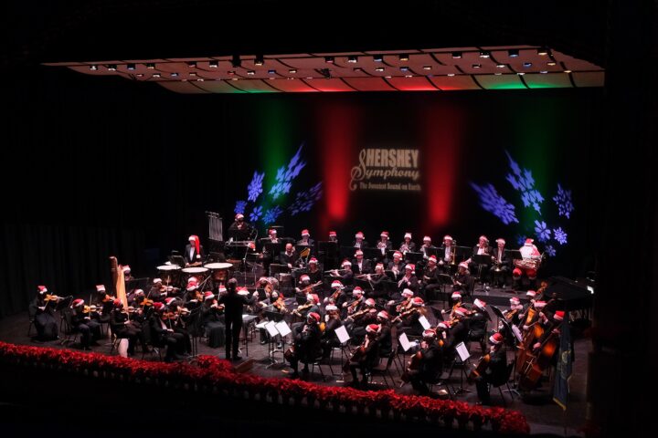 symphony orchestra on stage with snowflakes