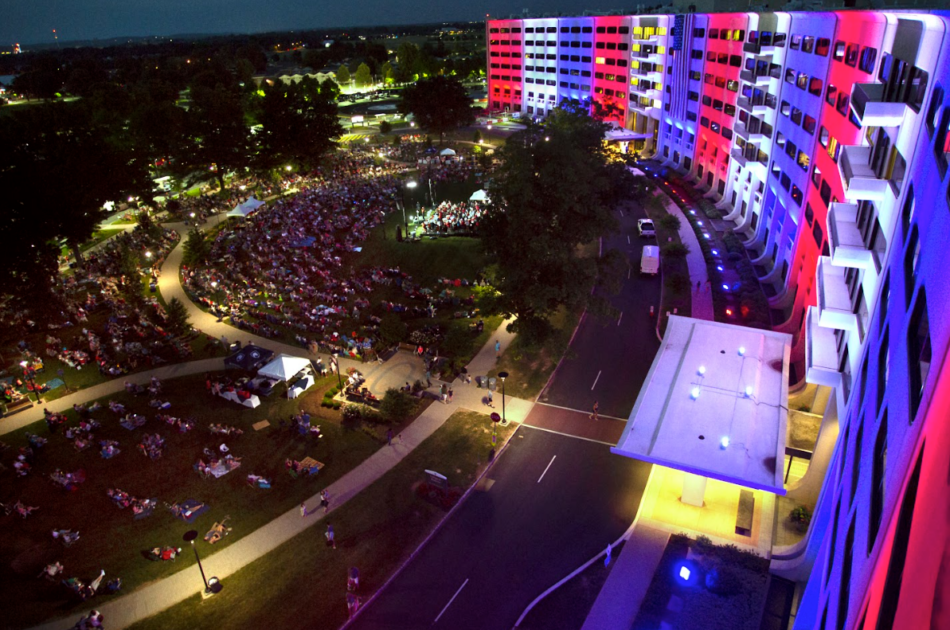 overhead view of building with red, white, and blue lights at night